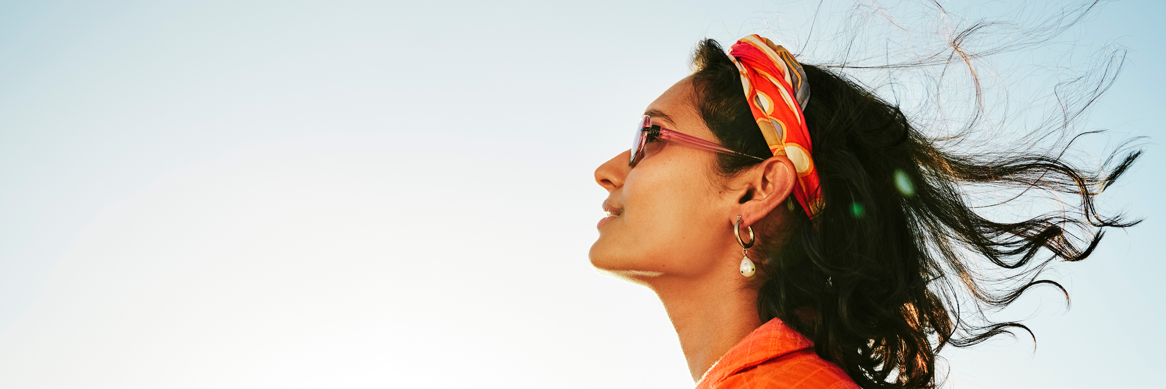 Woman's face with hair blowing in the wind