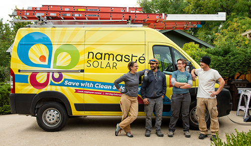 Namaste Solar employees in front of truck