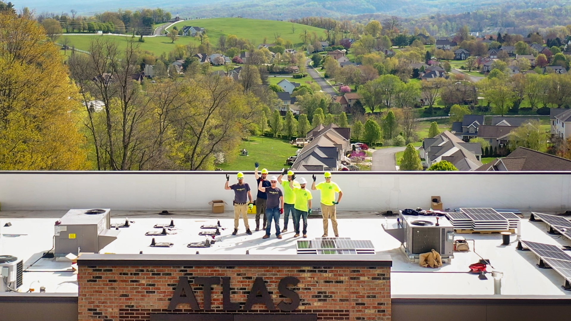 Solar Holler employees on roof